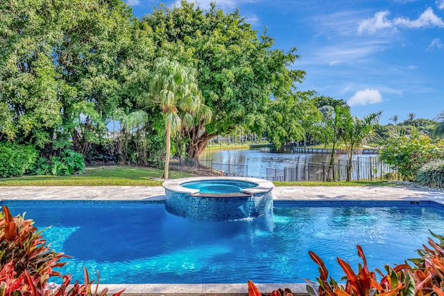 view of swimming pool featuring a water view and an in ground hot tub