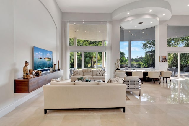 living room with a towering ceiling