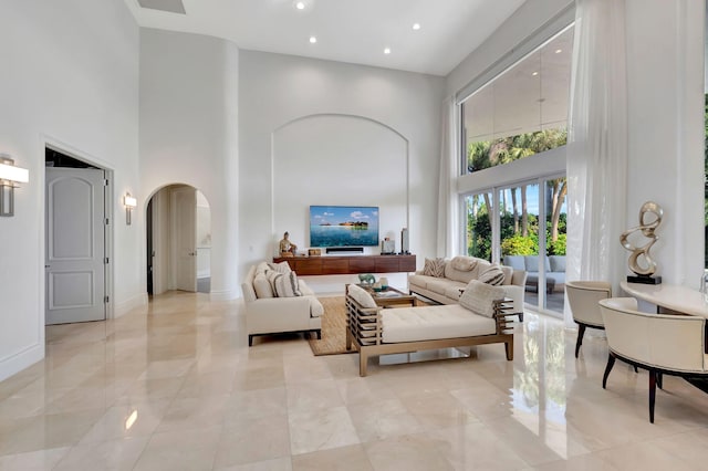 living room featuring a high ceiling