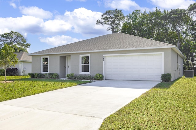 ranch-style home featuring central AC unit, a garage, and a front yard