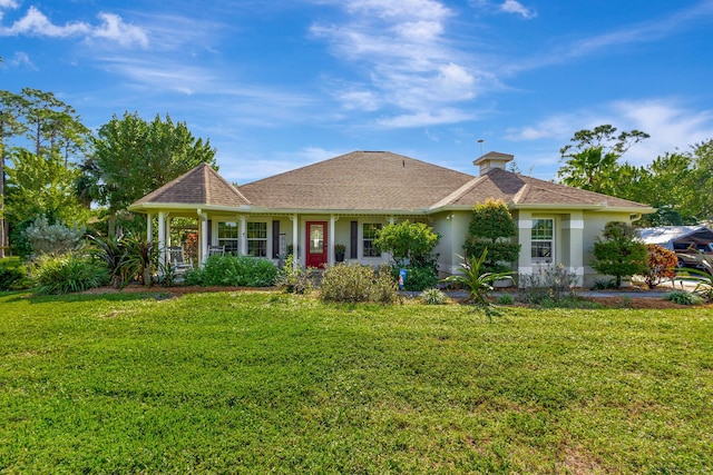 ranch-style home with a front yard