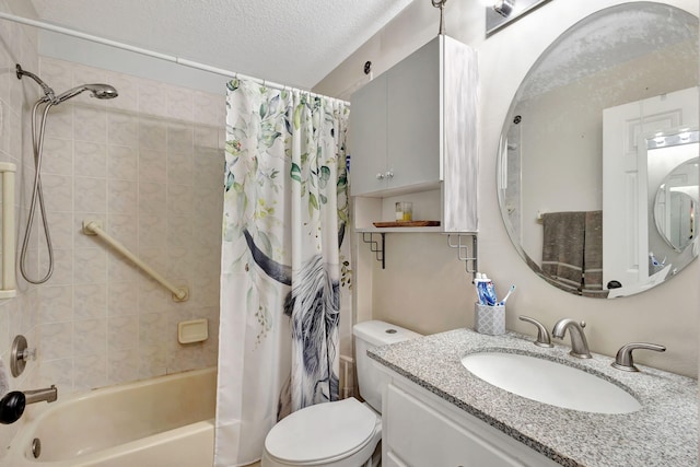 full bathroom featuring shower / bath combo, toilet, a textured ceiling, and vanity