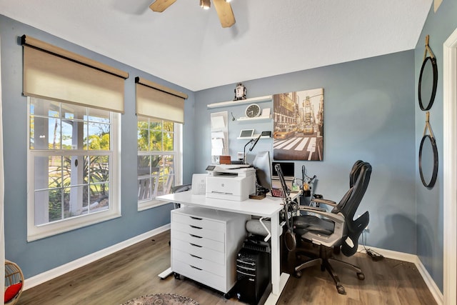 office area with ceiling fan and dark hardwood / wood-style floors