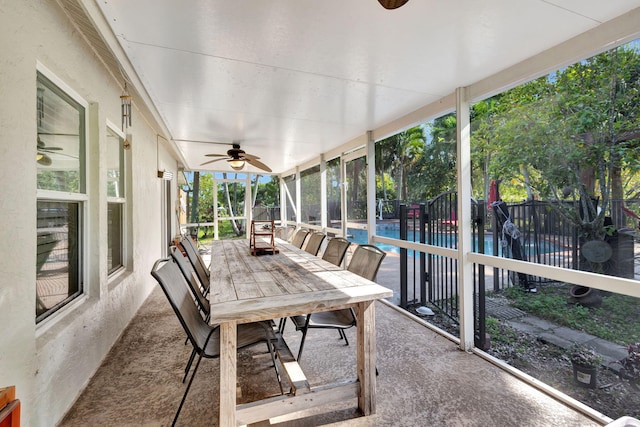 sunroom featuring ceiling fan