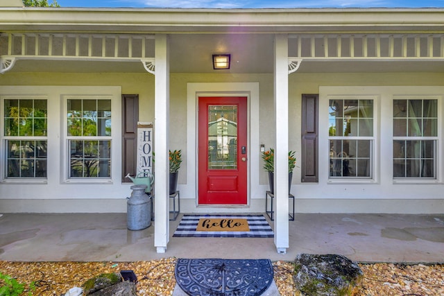 entrance to property featuring covered porch