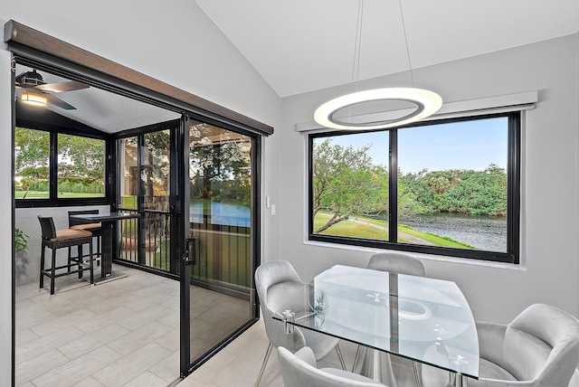 sunroom featuring plenty of natural light, ceiling fan, and vaulted ceiling