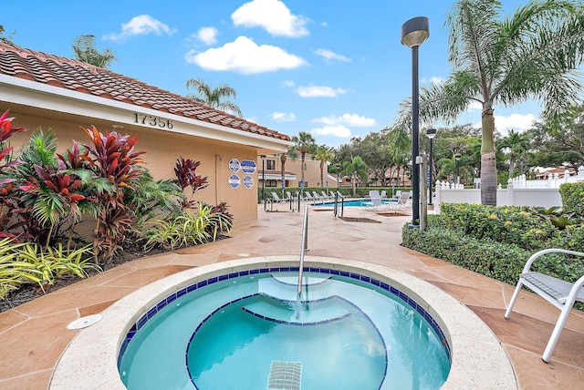 view of pool featuring a community hot tub