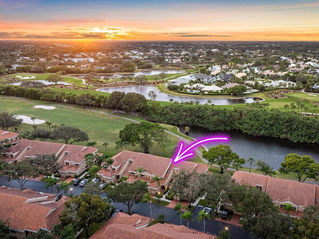 aerial view at dusk with a water view