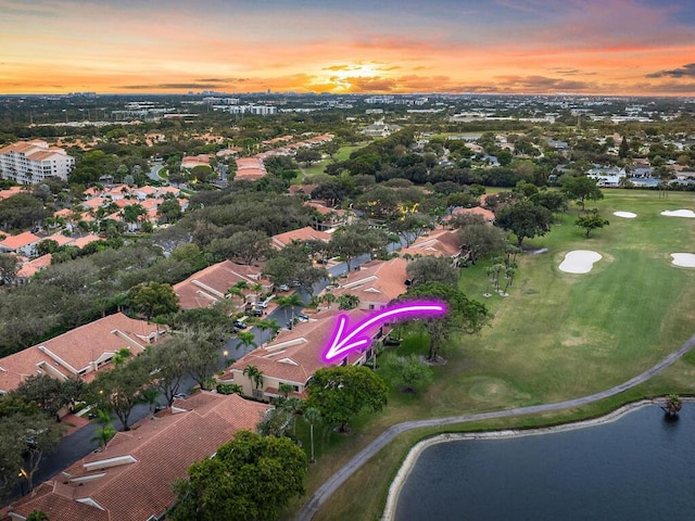 aerial view at dusk with a water view