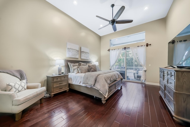 bedroom with access to outside, baseboards, dark wood-type flooring, and recessed lighting