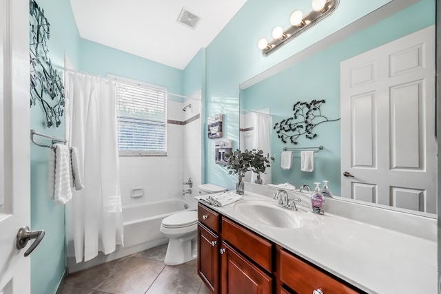 bathroom with visible vents, toilet, shower / tub combo, vanity, and tile patterned floors