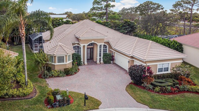 mediterranean / spanish house featuring a garage