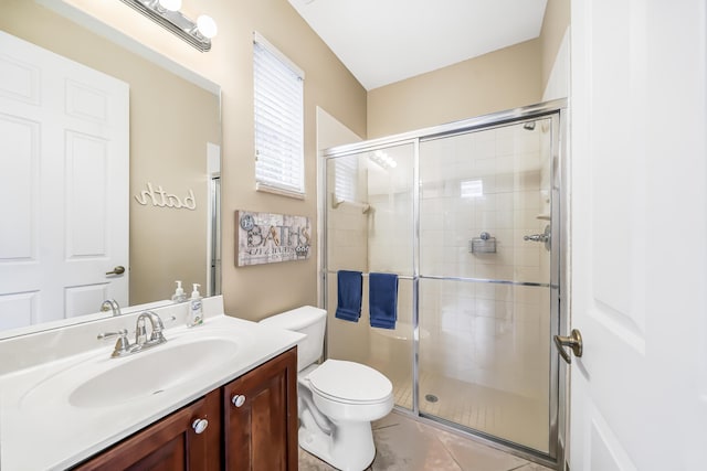 full bathroom featuring tile patterned flooring, a shower stall, toilet, and vanity