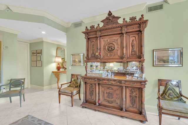 interior space featuring light tile patterned floors and crown molding