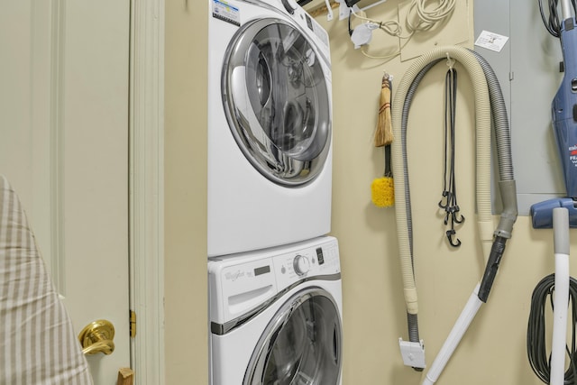 laundry room featuring stacked washer and dryer