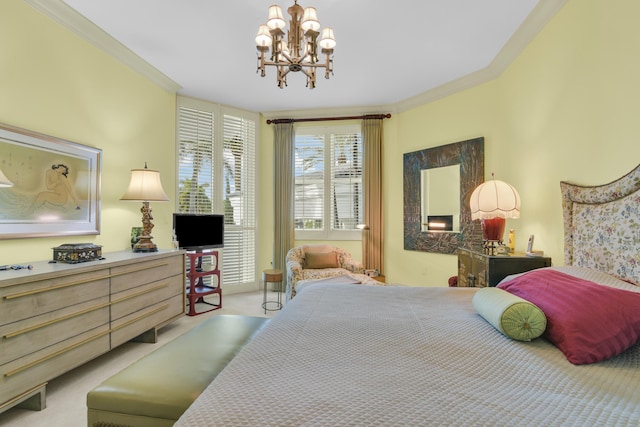 carpeted bedroom featuring a notable chandelier and ornamental molding