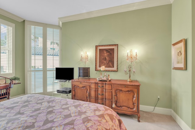 carpeted bedroom with ornamental molding and multiple windows