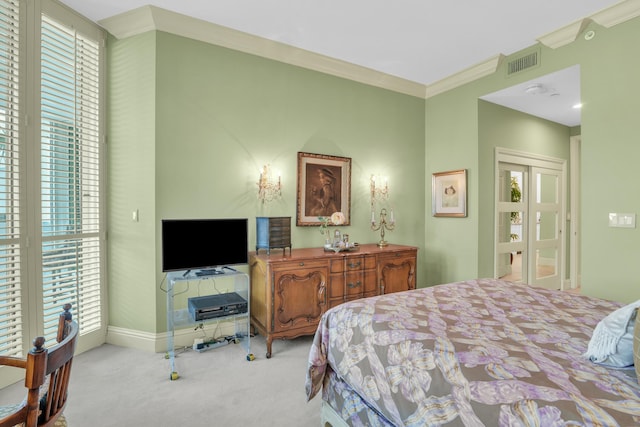 carpeted bedroom featuring ornamental molding