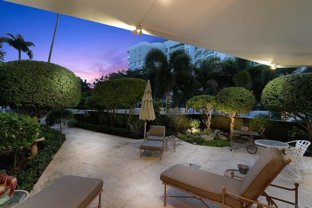 view of patio terrace at dusk