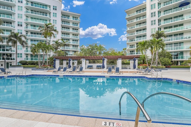 view of pool featuring a pergola and a patio