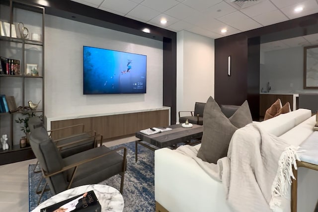 home theater room featuring a drop ceiling