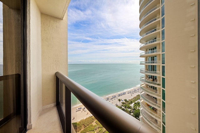 balcony with a view of the beach and a water view