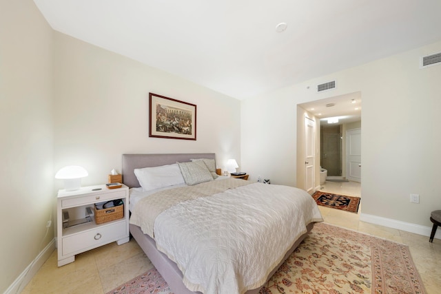 tiled bedroom with ensuite bath