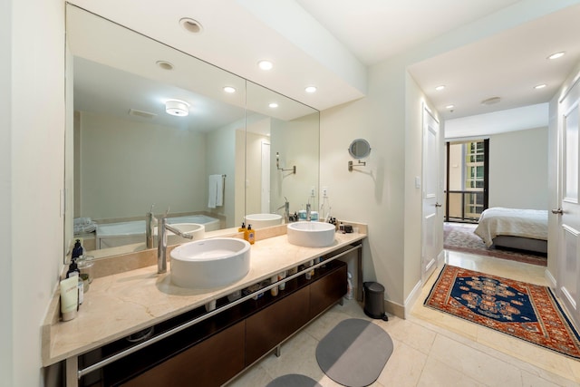 bathroom featuring tile patterned floors and vanity