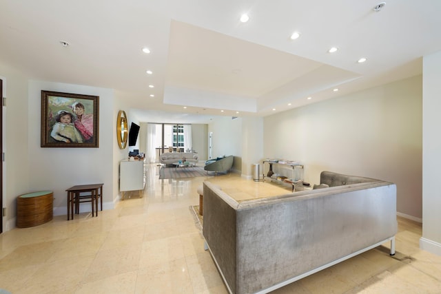 living room featuring a tray ceiling