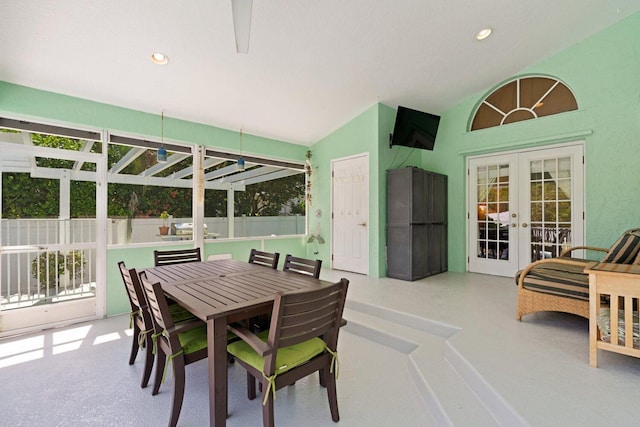 interior space featuring french doors and vaulted ceiling