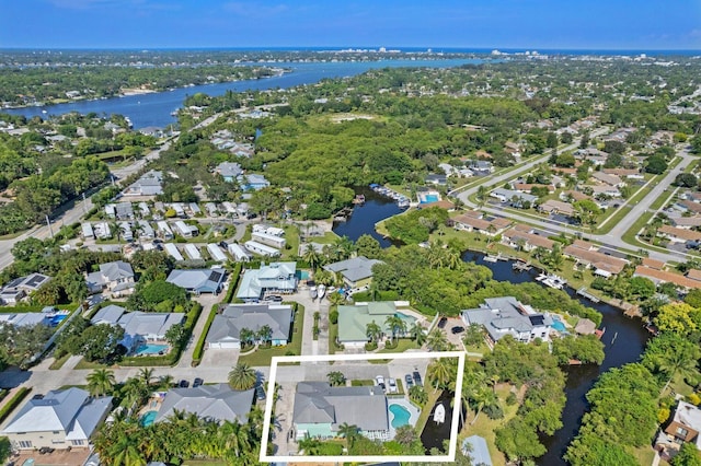 birds eye view of property featuring a water view