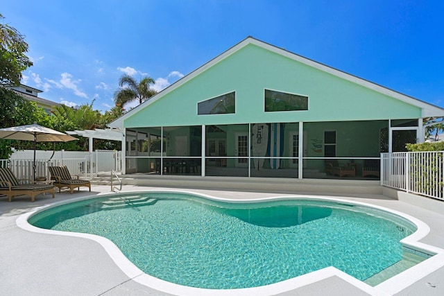 view of pool with a patio area and a sunroom