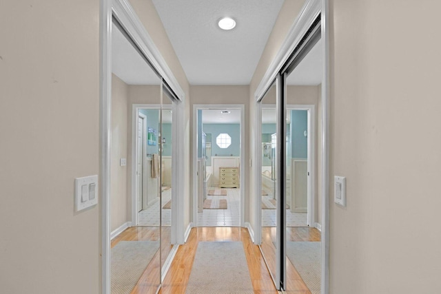 doorway with light hardwood / wood-style floors