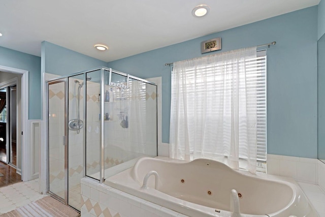 bathroom with shower with separate bathtub