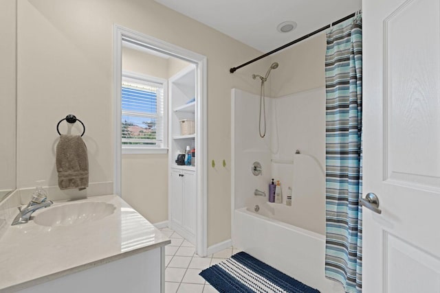 bathroom with tile patterned flooring, vanity, and shower / tub combo with curtain