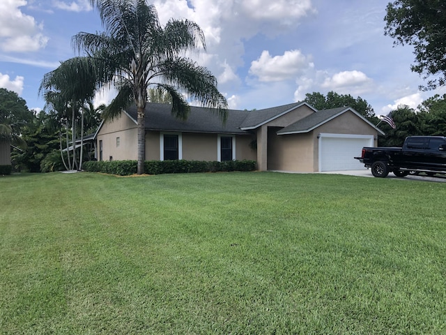 ranch-style house with a front yard and a garage