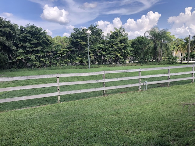 view of yard with a rural view