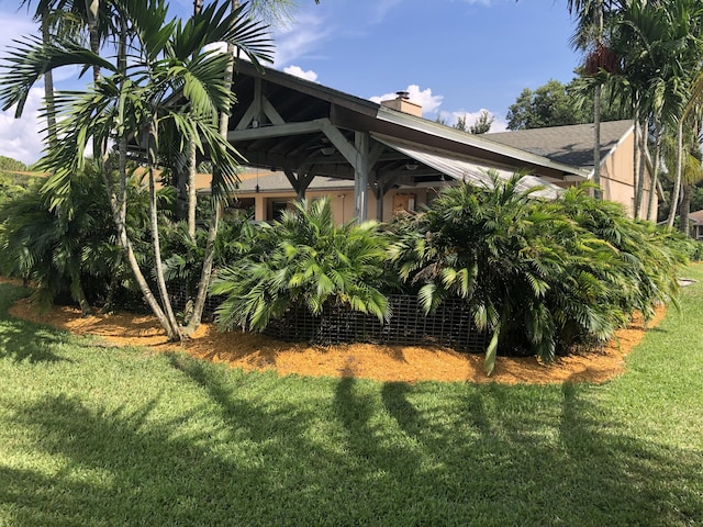 view of property exterior featuring a yard