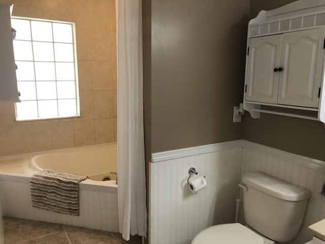 bathroom with tile patterned floors and toilet