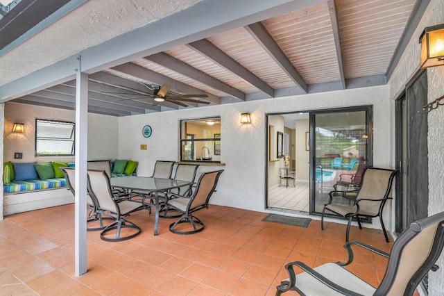 view of patio with ceiling fan and outdoor dining space