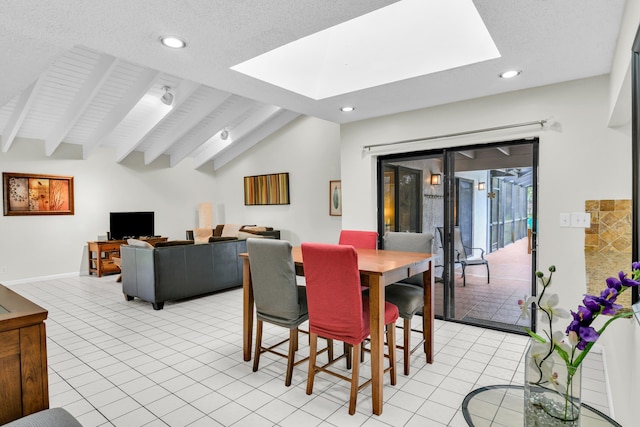 dining space with lofted ceiling with skylight, recessed lighting, a textured ceiling, and light tile patterned floors