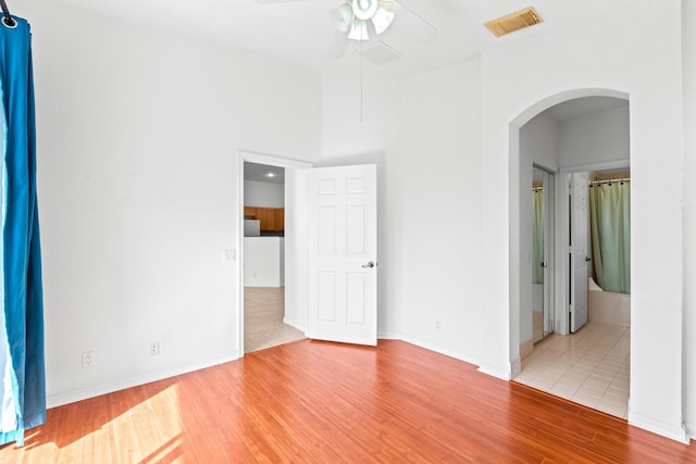 empty room featuring ceiling fan and hardwood / wood-style floors