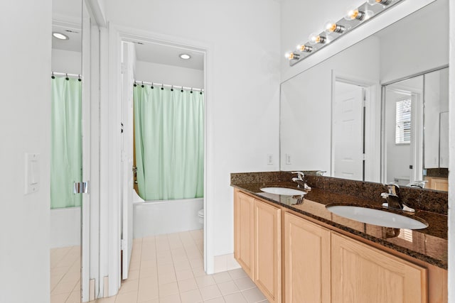 full bathroom with tile patterned flooring, vanity, toilet, and shower / bath combo