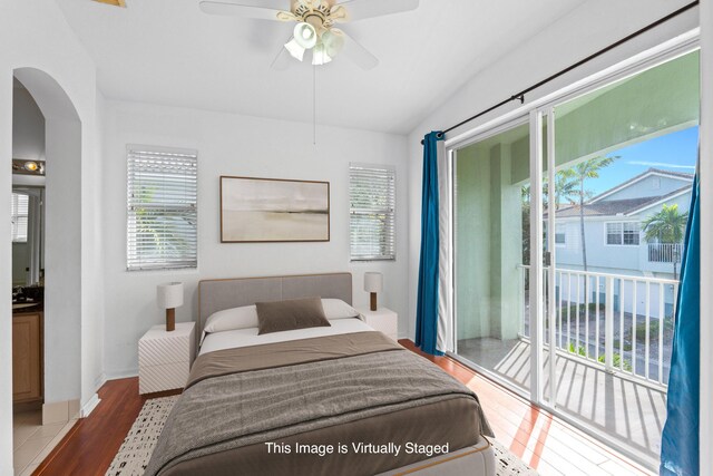 unfurnished living room with light tile patterned floors, a wealth of natural light, lofted ceiling, and ceiling fan