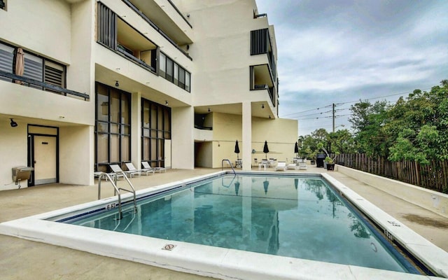 view of swimming pool with a patio area