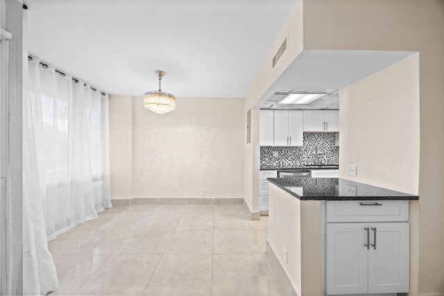 kitchen with white cabinets, dishwasher, pendant lighting, and sink