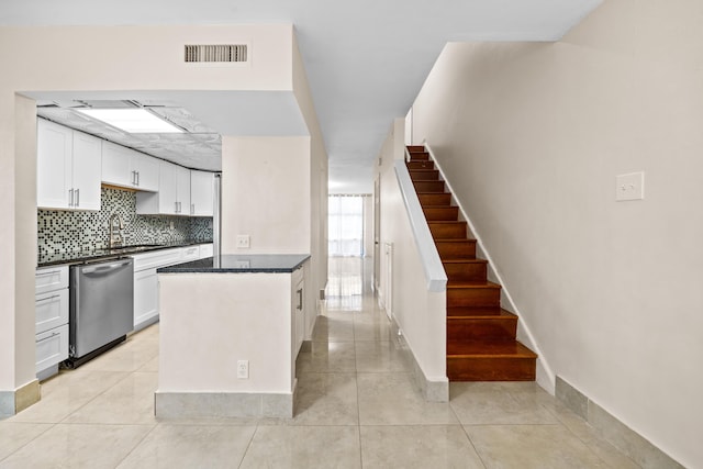 spare room with light tile patterned floors and ceiling fan