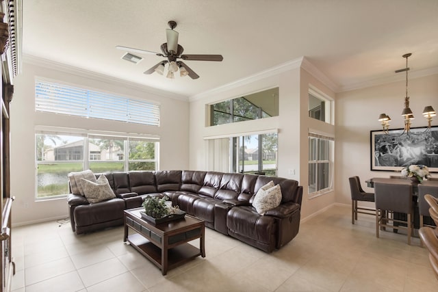 tiled living room featuring ceiling fan with notable chandelier and ornamental molding