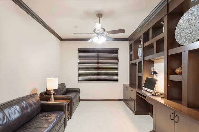 office area with crown molding, built in features, ceiling fan, and built in desk