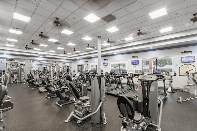 gym featuring a paneled ceiling and ceiling fan